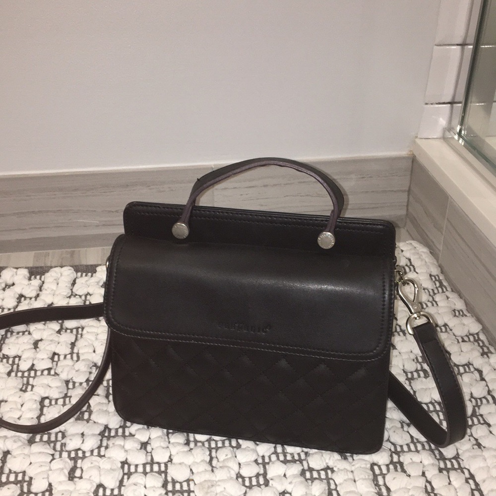 M. Fredric. This bag was made in Spain.